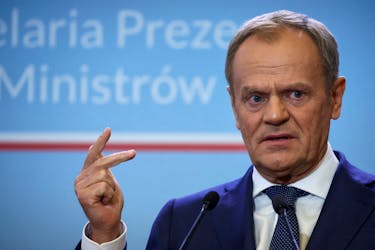 Polish Prime Minister Donald Tusk gestures during a press conference with Danish Prime Minister Mette Frederiksen in Warsaw, Poland, April 15, 2024.