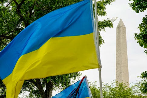 A Ukrainian flag is seen as pro-Ukrainian demonstrators march along the National Mall in Washington, U.S., May 1, 2022.