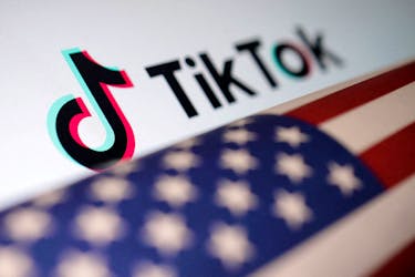 U.S. flag is placed on a TikTok logo in this illustration taken March 20, 2024.