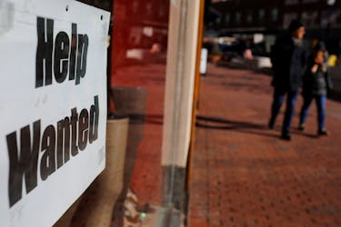 A "Help Wanted" sign sits in the window of a shop in Harvard Square in Cambridge, Massachusetts, U.S., February 11, 2019.  