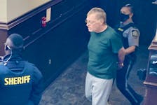 Convicted child molester Myles Nelson Payne is led into Halifax provincial court last September. Payne, 61, pleaded guilty recently to two charges: violating a long-term supervision order and breaching a prohibition on attending parks and other places frequented by children.