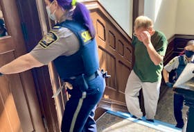 Convicted child molester Myles Nelson Payne is led into Halifax provincial court last September. Payne, 61, pleaded guilty recently to two charges: violating a long-term supervision order and breaching a prohibition on attending parks and other places frequented by children.