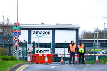 Security is seen during industrial action outside the Amazon warehouse, in Coventry, Britain March 19, 2024.