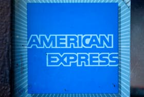 The logo of Dow Jones Industrial Average stock market index listed company American Express (AXP) is seen in Los Angeles, California, United States, April 25, 2016.