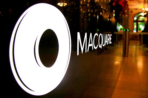 The logo of Australia's biggest investment bank Macquarie Group Ltd adorns a desk in the reception area of their Sydney office headquarters in Australia, October 28, 2016.   