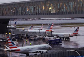 American Airlines planes are seen at gates at LaGuardia Airport ahead of the Thanksgiving holiday, in New York City, U.S., November 21, 2023. 