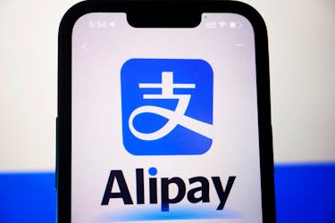 The logo of Alipay is seen through the camera of the app on a mobile phone, in this illustration picture taken June 28, 2023.