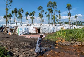 A displaced Congolese child walks at a new site, after fleeing their village following clashes between M23 rebels and the Armed Forces of the Democratic Republic of the Congo (FARDC), in Sake, the Democratic Republic of Congo February 6, 2024.