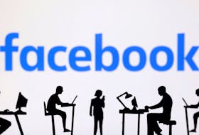Figurines with computers and smartphones are seen in front of Facebook logo in this illustration taken, February 19, 2024.