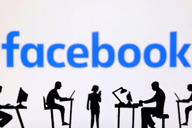 Figurines with computers and smartphones are seen in front of Facebook logo in this illustration taken, February 19, 2024.