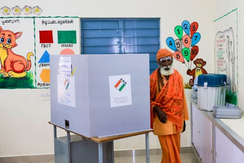 Rama Chandra, 76, a Sadhu or a Hindu holy man, votes at a polling station during the first phase of the general election, at Tiruvannamalai in Tamil Nadu, India, April 19, 2024.