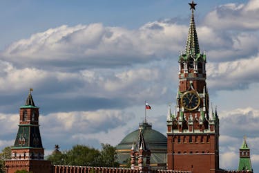 The Russian flag flies on the dome of the Kremlin Senate building behind Spasskaya Tower, in central Moscow, Russia, May 4, 2023.