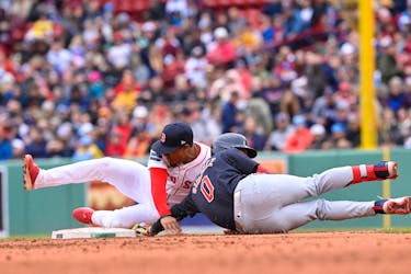 Apr 18, 2024; Boston, Massachusetts, USA;  Boston Red Sox second baseman Enmanuel Valdez (47)  tags Cleveland Guardians second baseman Andres Gimenez (0) out during the third inning at Fenway Park. Mandatory Credit: Eric Canha-USA TODAY Sports