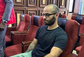 Tigran Gambaryan, an executive of Binance, the world's largest cryptocurrency exchange, sits as he waits to face prosecution for tax evasion and money laundering at the federal high court in Abuja, Nigeria April 4, 2024.