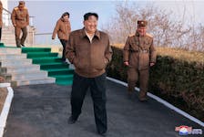 North Korean leader Kim Jong-un attends a ground test of a solid-fuel engine for a new type of intermediate-range hypersonic missile as part of a program of developing national defense capability, at an unknown location in North Korea, March 19, 2024. KCNA via