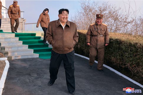 North Korean leader Kim Jong-un attends a ground test of a solid-fuel engine for a new type of intermediate-range hypersonic missile as part of a program of developing national defense capability, at an unknown location in North Korea, March 19, 2024. KCNA via