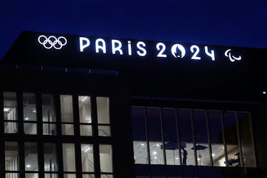 FIEL PHOTO: The Olympics rings and the logos of the Paris 2024 Olympics and Paralympics Games are pictured on the Pulse building, the headquarters of the Paris 2024 Olympics organizing committee, in Saint-Denis near Paris, France, March 21, 2024.