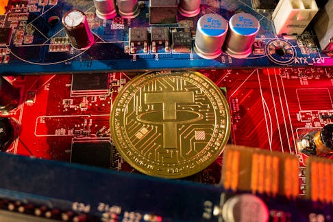 A representation of cryptocurrency Tether is placed on a PC motherboard, in this illustration taken June 16, 2023.