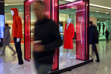 People walk past mannequins in a shopping centre in London, Britain, January 17, 2023.