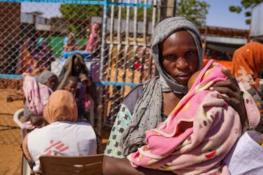 A handout photograph, shot in January 2024, shows a woman and baby at the Zamzam displacement camp, close to El Fasher in North Darfur, Sudan.  MSF/Mohamed Zakaria/Handout via
