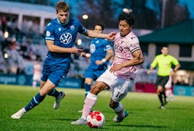 Halifax Wanderers defender Dan Nimick battles for the ball against Vancouver FC attacker Moses Dyer during Canadian Premier League action Thursday night in Langley, B.C. - CANADIAN PREMIER LEAGUE