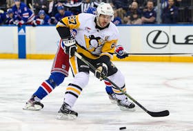Pittsburgh Penguins captain Sidney Crosby battle for the puck with New York Rangers defenceman K'Andre Miller during the first period Monday night at Madison Square Garden. - Danny Wild / USA Today Sports