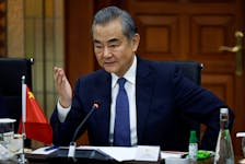 Chinese foreign minister Wang Yi gestures as he speaks during a bilateral meeting with Indonesian foreign minister Retno Marsudi in Jakarta, Indonesia, April 18, 2024.