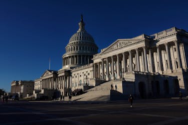 People walk past the U.S. Capitol building in Washington, U.S., January 11, 2024.