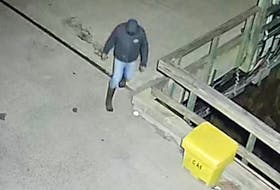 Police released a photo Friday of a man they say is a person of interest related to an arson at the Back Bay wharf Thursday morning, April 18.