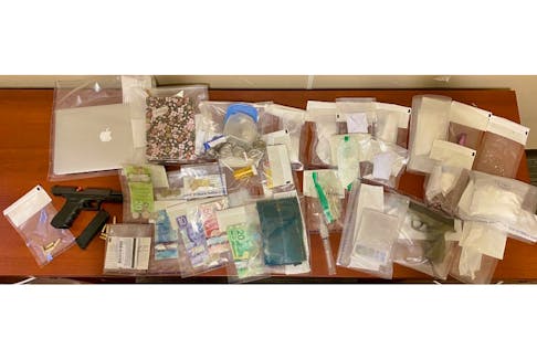 Mounties arrested three people and seized drugs, a stolen handgun and other items consistent with drug trafficking after searching a Three Brooks, N.S., home on April 17.