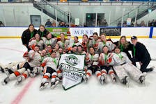 The Charlottetown-based Central Storm celebrate and pose for a team photo after winning the 2024 Atlantic under-15 AAA female hockey championship in North Rustico on April 21. The Storm defeated Nova Scotia’s Metro Force West Citadels 7-3 in the gold-medal game. Contributed