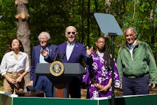 U.S. President Joe Biden gestures as U.S. Senator Bernie Sanders (I-VT), U.S. Representative Alexandria Ocasio-Cortez (D-NY), U.S. Senator Ed Markey (D-MA) and Za'Nyia Kelly stand with him, at an event to commemorate Earth Day during a visit to Prince William Forest Park in Triangle, Virginia, U.S., April 22, 2024. 