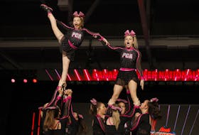 U16 Level 3 Blinc flyers Madelyn Howie and Matheson Swartzack at the top of a lift during their bronze medal-winning routine. CONTRIBUTED/CANADIAN CHEER NATIONAL CHAMPIONSHIPS