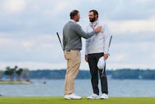 Apr 22, 2024; Hilton Head, South Carolina, USA; Scottie Scheffler talks with Sepp Straka on the 18th green after winning the RBC Heritage golf tournament. Play was suspended on Sunday, due to inclement weather. Mandatory Credit: Aaron Doster-USA TODAY Sports