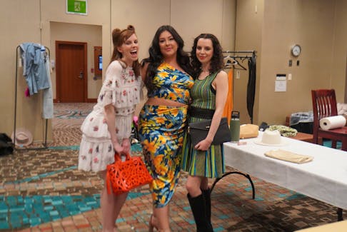Ellen Astle, left, joins Emily Anne Fullerton and Julie McKenna backstage as they get ready to walk the runway at the P.E.I. Fashion Show Extravaganza on April 19 The event took place at the Delta Hotel Prince Edward Convention Centre in downtown Charlottetown. They were wearing outfits from Luxury Market Consignment Boutique, a clothing store located in downtown Charlottetown. Vivian Ulinwa • SaltWire