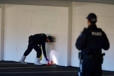 Officers with the Halifax regional police forensics unit, begin to process the scene inside a parkade at the Halifax Shopping Centre in Halifax Monday April 22, 2024.

TIM KROCHAK PHOTO