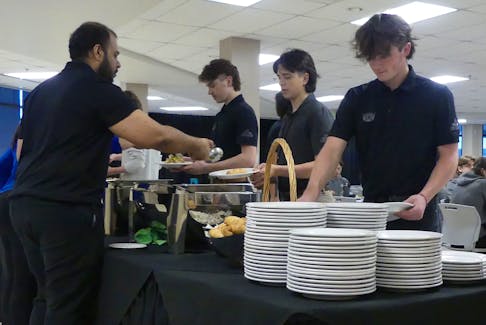 Magog Cantonniers hockey players and staff get lunch, courtesy of the Membertou Trade and Convention Centre, before their first day of Telus Cup gameplay at the Membertou Sports and Wellness Centre. The Membertou Trade and Convention Centre is providing lunch and dinner for all six teams throughout the tournament. Mitchell Ferguson/Cape Breton Post