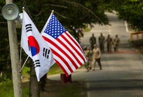 The South Korean and American flags fly next to each other at Yongin, South Korea, August 23, 2016. Picture taken on August 23, 2016.  Courtesy Ken Scar/U.S. Army/Handout via