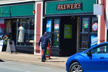 A man walks into Brewer's Convenience on Commercial Street in North Sydney on Tuesday. The store was the location where a winning ticket was sold worth $1.5 million. NICOLE SULLIVAN/CAPE BRETON POST