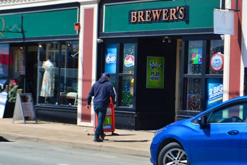 A man walks into Brewer's Convenience on Commercial Street in North Sydney on Tuesday. The store was the location where a winning ticket was sold worth $1.5 million. NICOLE SULLIVAN/CAPE BRETON POST