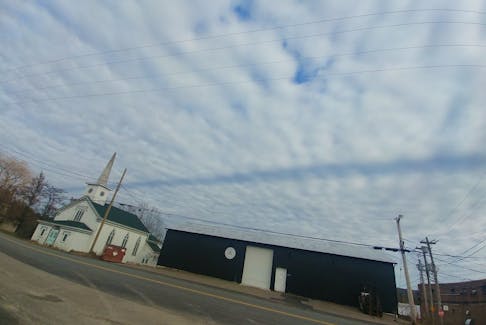 This dark line across the clouds in Falmouth, N.S., appears to be a contrail shadow. -Contributed/Joan Alyward Mansfield