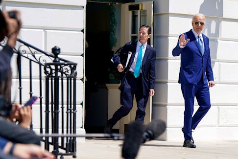 U.S. President Joe Biden walks towards Marine One with staff as he departs the White House en route to Tampa, Florida, in Washington, U.S., April 23, 2024.