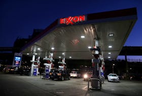 Cars are seen at an Exxon gas station in Brooklyn, New York City, U.S., November 23, 2021.