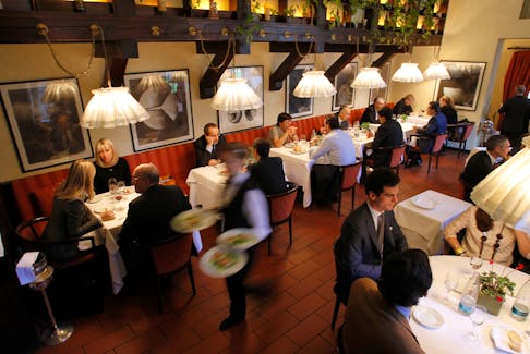 Guests are seen at "Don Lisander" restaurant in downtown Milan November 10, 2011.
