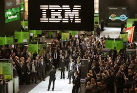 Employees follows a speech at the booth of IBM at CeBIT computer fair in Hanover March 3, 2009.