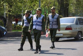 Iran's police forces walk on a street amid the implementation of the new hijab surveillance in Tehran, Iran, April 15, 2023. Majid Asgaripour/WANA (West Asia News Agency) via