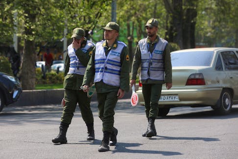 Iran's police forces walk on a street amid the implementation of the new hijab surveillance in Tehran, Iran, April 15, 2023. Majid Asgaripour/WANA (West Asia News Agency) via