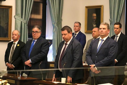 Members of the Progressive Conservative front bench listen as Lt.-Gov. Antoinette Perry closes out the spring sitting of the P.E.I. legislature. – Stu Neatby