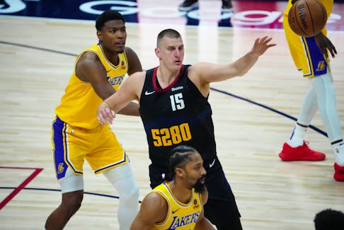 Apr 22, 2024; Denver, Colorado, USA; Los Angeles Lakers forward Rui Hachimura (28) defends Denver Nuggets center Nikola Jokic (15) in the second half during game two during the 2024 NBA playoffs at Ball Arena. Mandatory Credit: Ron Chenoy-USA TODAY Sports