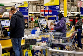 People use self-checkout counters at a Metro Cash and Carry hypermarket in Moscow, Russia December 22, 2023.
